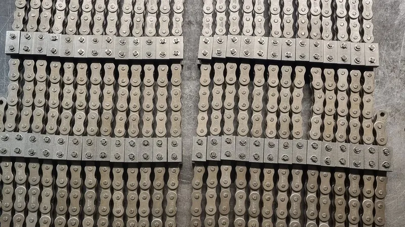 Cut lengths of attachment chain assembled on the workshop bench in Malvern
