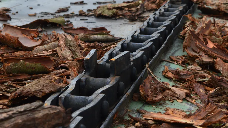 Scraper chain with flights working through bark and residuals at a sawmill
