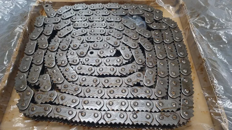 MAXTOP sharp top chain with serrated tooth plates, coiled in the stock box in Malvern