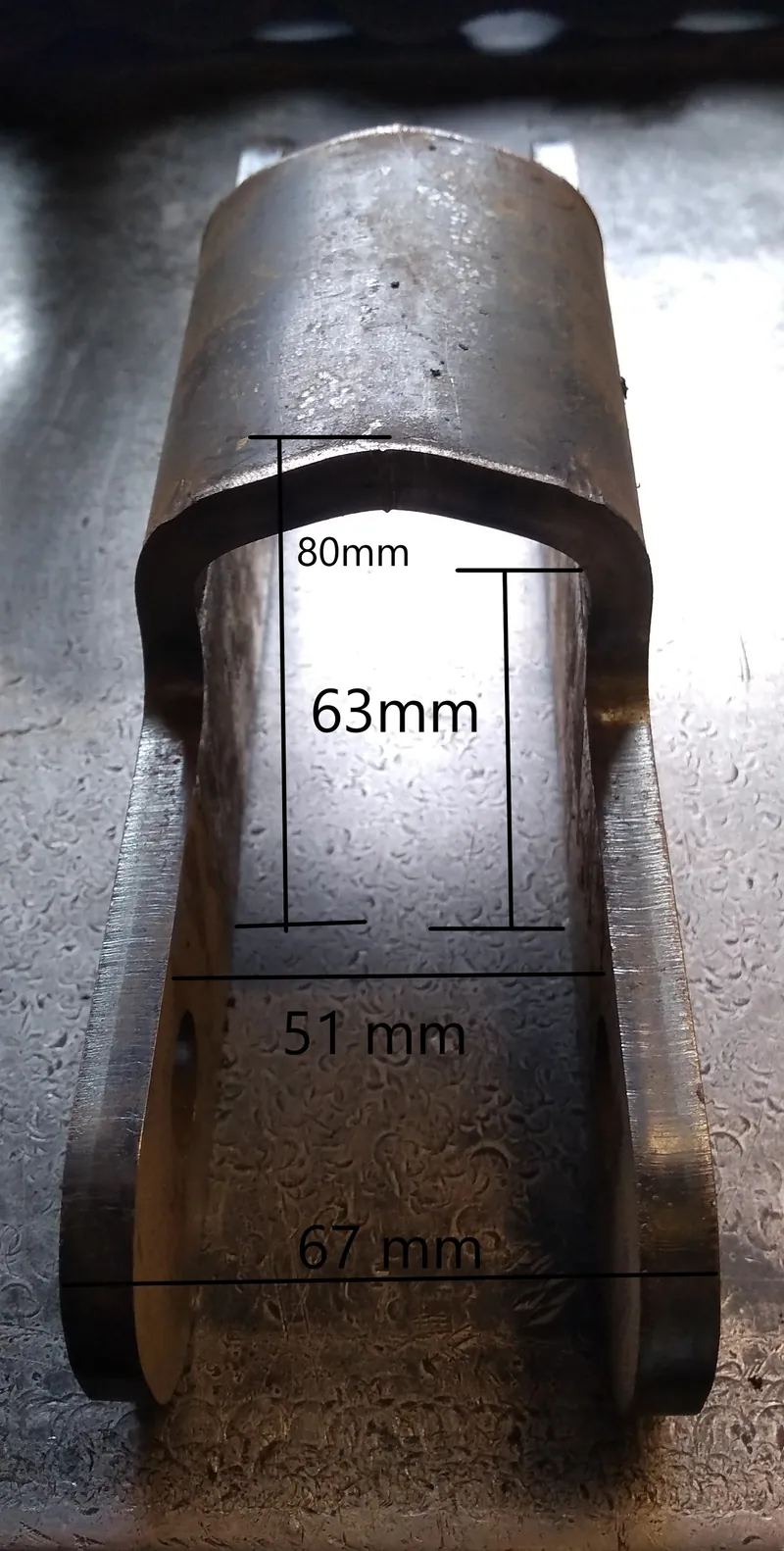 Welded steel link barrel profile measured on the bench with widths and bore marked